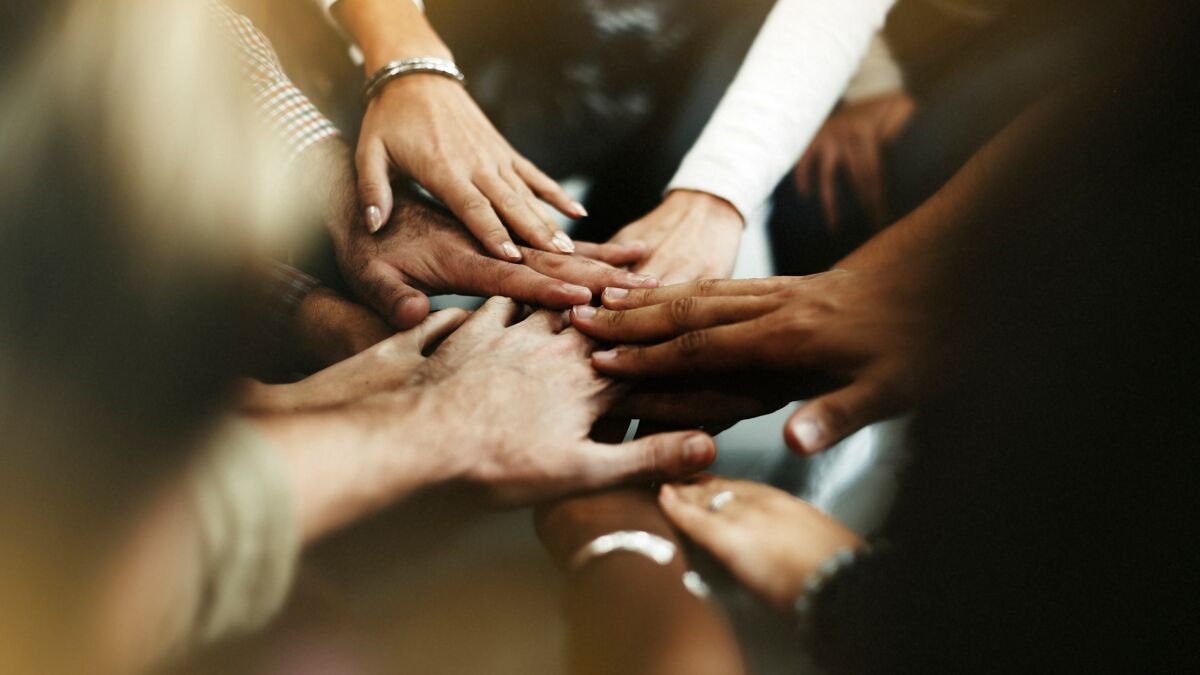 hands together in a huddle