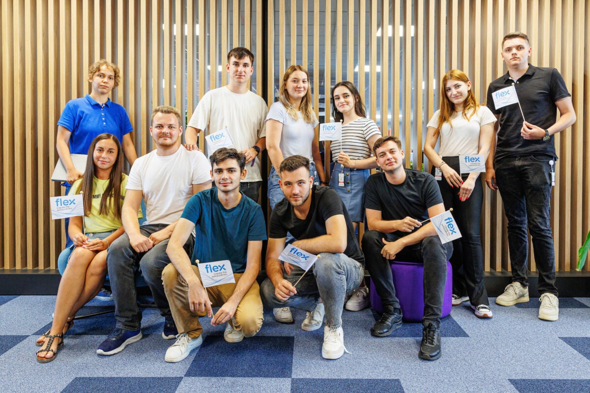 Group picture of Flex interns standing, sitting, and crouching together